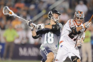 ANNAPOLIS, MD - JULY 31: Ben Hunt #18 of the Chesapeake Bayhawks takes a shot with presure from on Ken Clausen #27 of the Denver Outlaws during a MLL lacrosse game on July 31, 2014 at Navy-Marine Corps Memorial Stadium in Annapolis, Maryland. (Photo by Mitchell Layton/Getty Images)